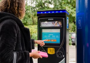 Woman using Touchscreen Elite LS Parking Terminal