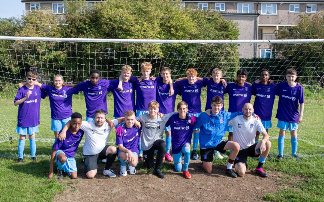 Back of the net for Abbey Meads U15’s football team scoring Metric Group as shirt sponsor